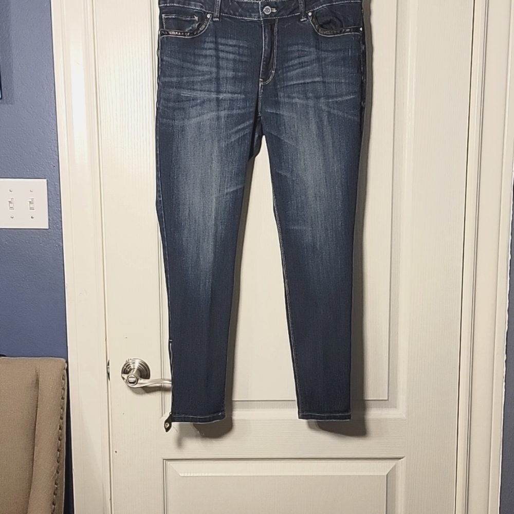 Jeans with faux leather ate front and back pockets.
